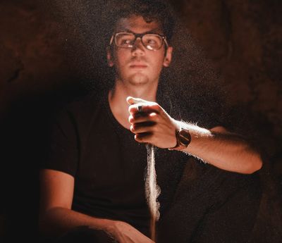 Close-up of a person's hands in a meditative pose.